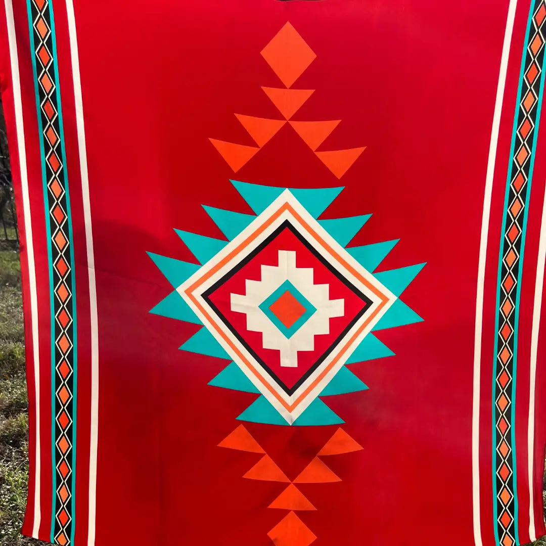 Red bandana silk scarf with large print of cream, red, turquoise and adobe and orange.