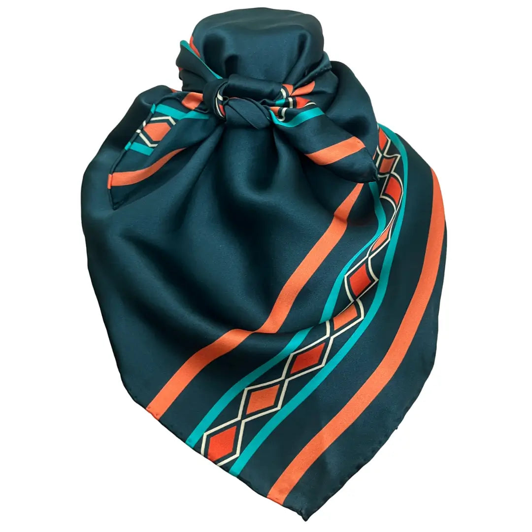 Blue bandana silk scarf with large print of cream, red, turquoise and adobe orange.