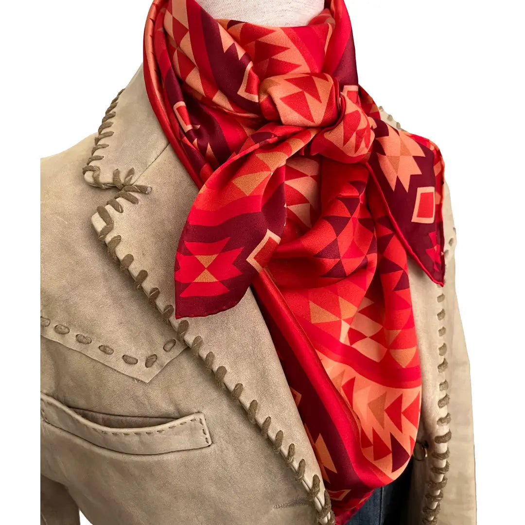 Silk scarves - Close-up of an Aztec wild rag silk scarf with red, maroon, copper and peach.