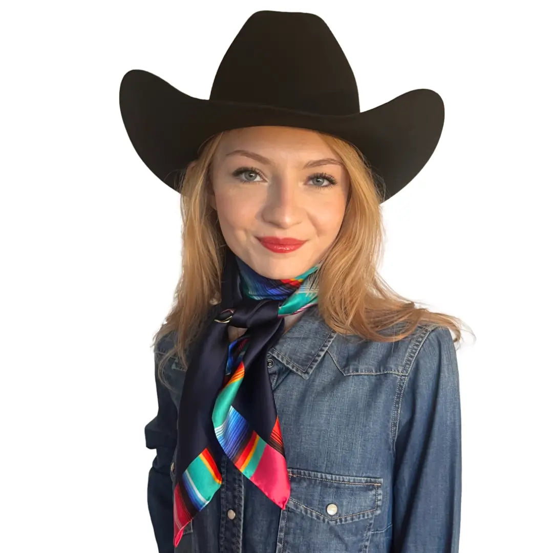 Wild rags for women - Cowgirl wearing a Cowtown Wild Rags Aztec silk scarf with navy blue and a serape design.