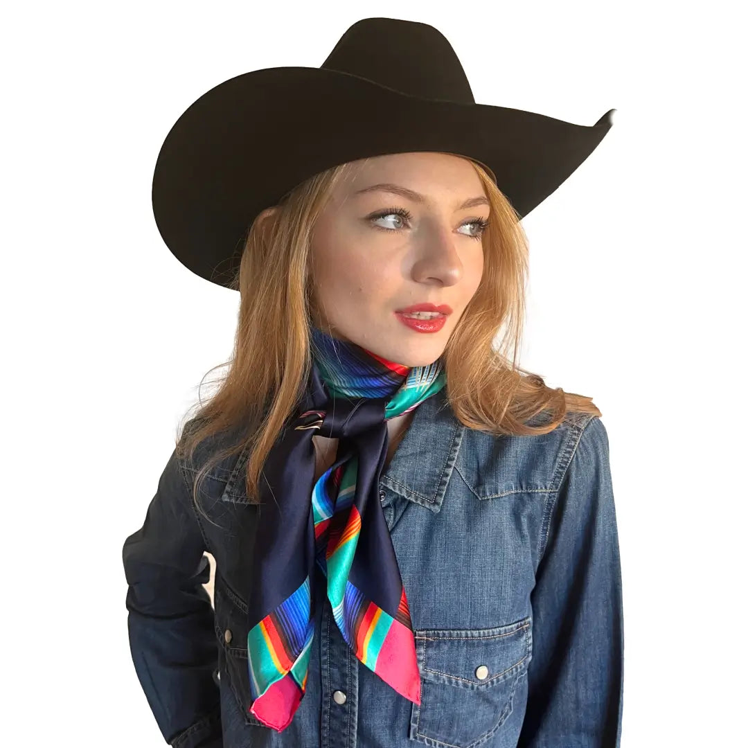 Wild rags for women - Cowgirl wearing a Cowtown Wild Rags Aztec silk scarf with navy blue and a serape design.