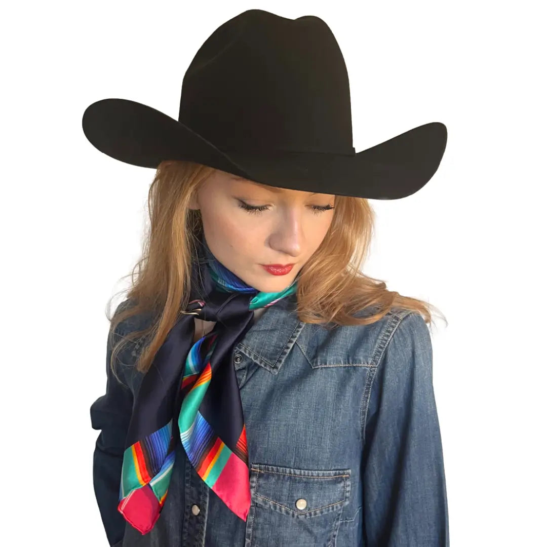 Wild rags for women - Cowgirl wearing a Cowtown Wild Rags Aztec silk scarf with navy blue and a serape design.