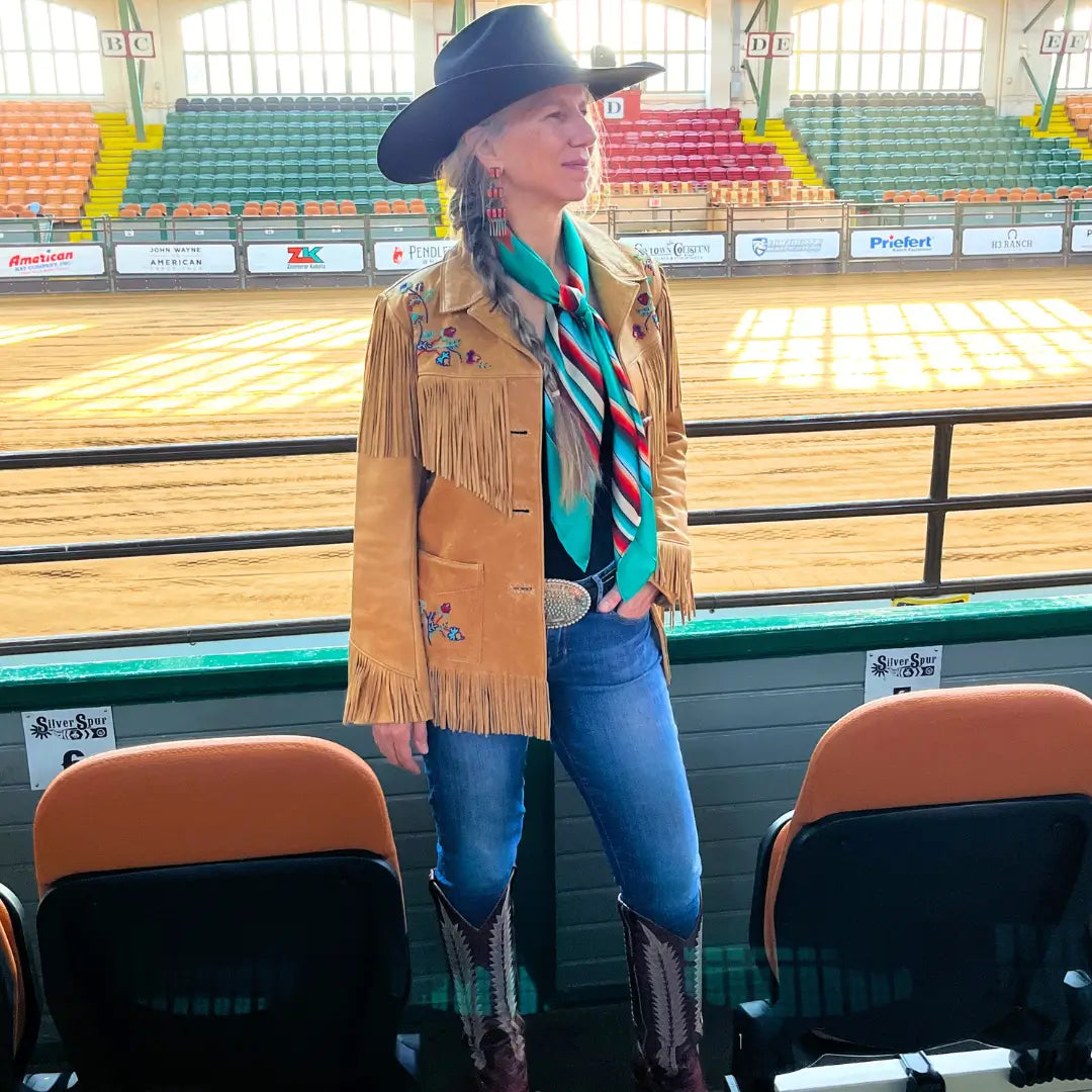 Western Silk Scarf - Cowgirl wearing a Cowtown Wild Rags turquoise serape silk scarf with tan, maroon, and coral.