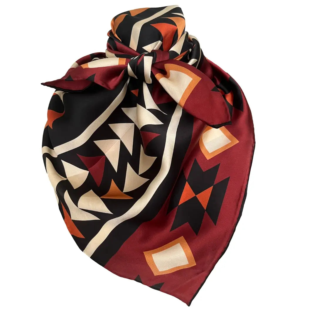 Large Aztec print design with mahogany, copper, burnt orange, cream and black.