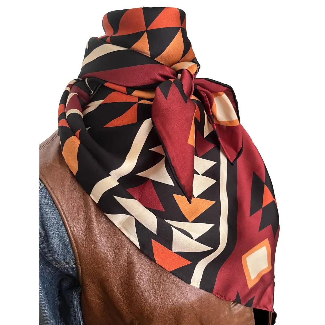 Large Aztec print design with mahogany, copper, burnt orange, cream and black.