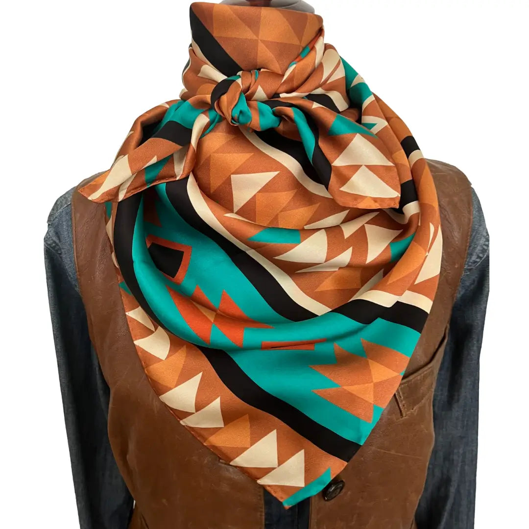 Large Aztec print design with turquoise, copper, burnt orange, cream and black.