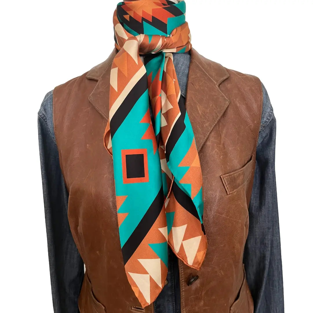 Large Aztec print design with turquoise, copper, burnt orange, cream and black.