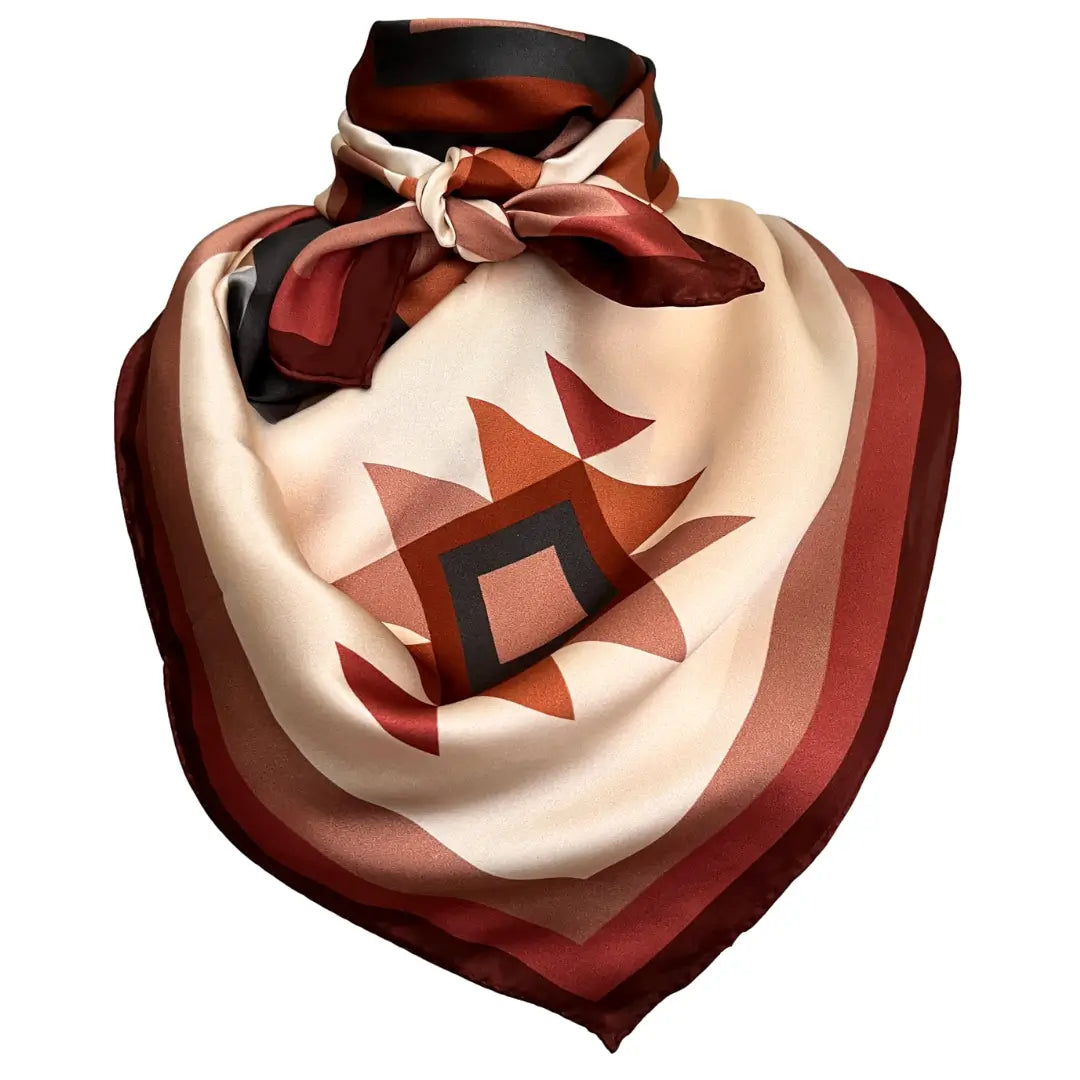 Cowtown Wild Rags large Aztec design silk scarf with soft tan, maroon, copper, dusty pink, and charcoal gray.