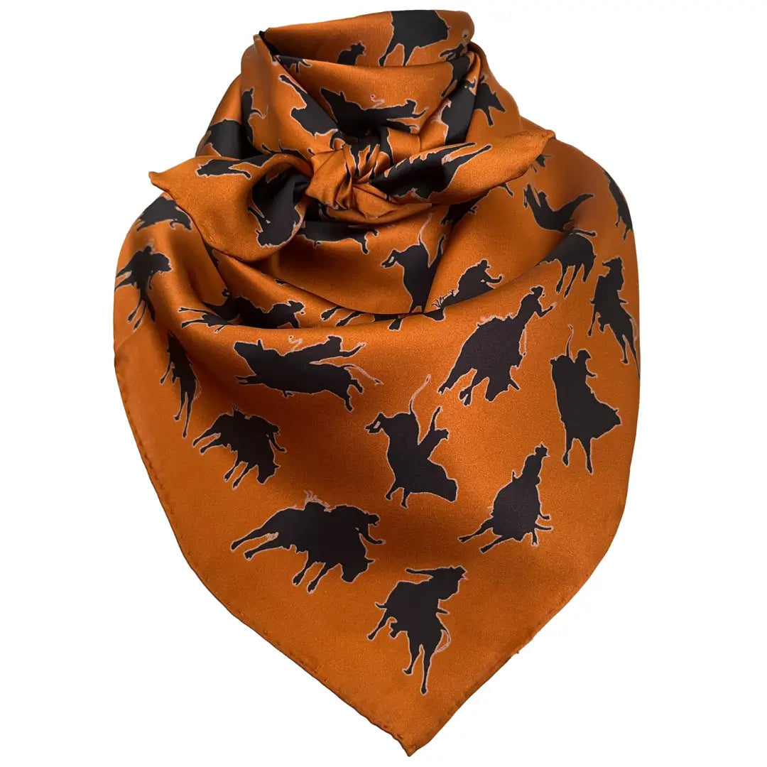 Black silhouette bull riders outlined in tan on a sienna silk scarf.