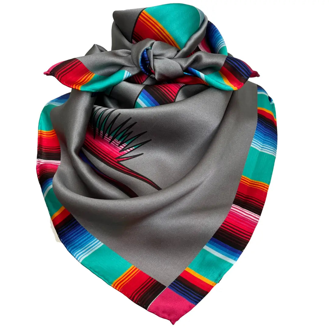 Cowtown Wild Rags Aztec silk scarf with gray and a serape design of a cowgirl and horse.