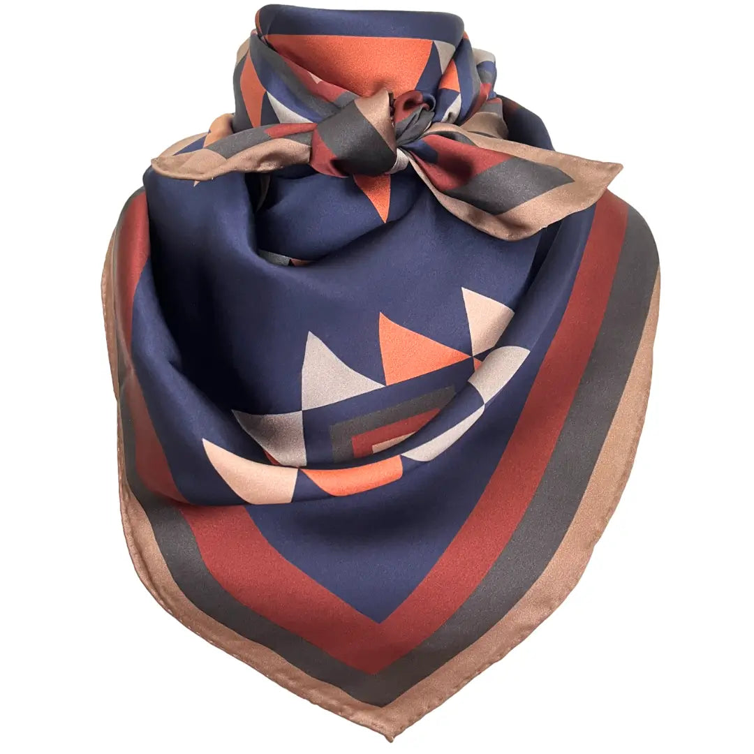 Cowtown Wild Rags Aztec silk scarf with navy blue, soft tan, copper, and charcoal gray.