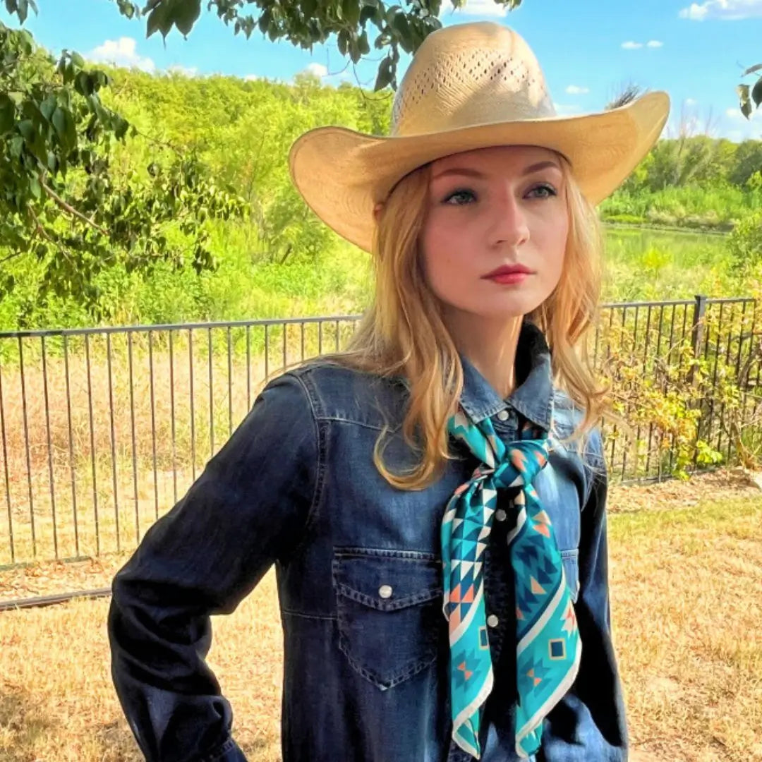 Cowgirl wearing an Aztec wild rag turquoise silk scarf.