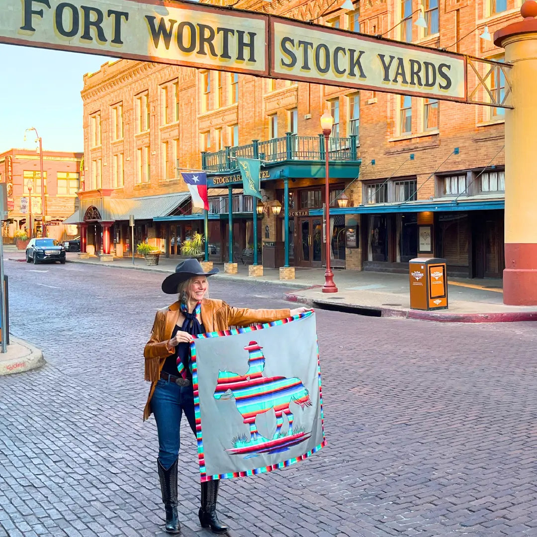 Cowtown Wild Rags Aztec silk scarf with gray and a serape design of a cowgirl and horse in the Fort Worth Stockyards.