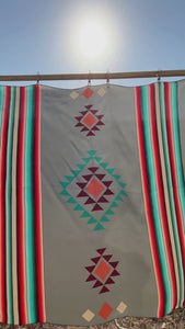 Video of a Cowtown Wild Rags gray serape silk scarf with turquoise, maroon, and coral.