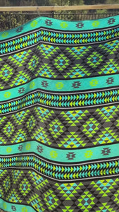 Video of an Aztec wild rag silk scarf with turquoise, neon green, gray, and black.