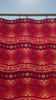 Video of an Aztec wild rag silk scarf with red, maroon, copper and peach.