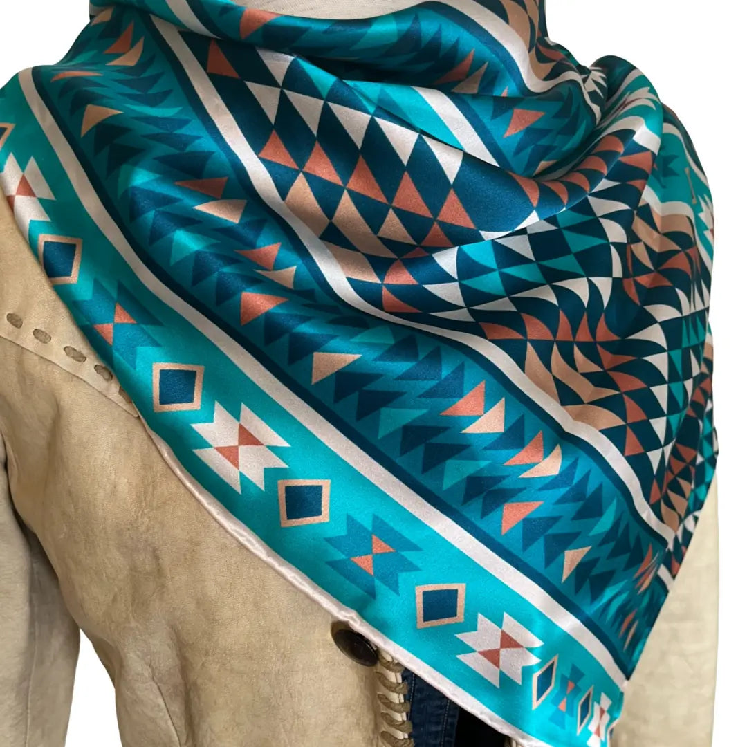 Close-up of an Aztec wild rag turquoise silk scarf